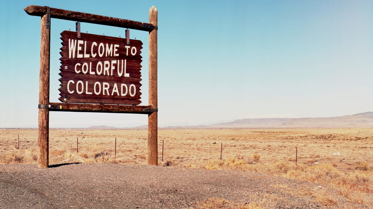 The Welcome to Colorful Colorado sign at the state line